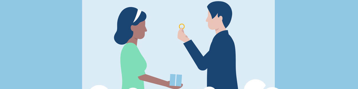 Een man met een ring in zijn hand en daarnaast een vrouw
